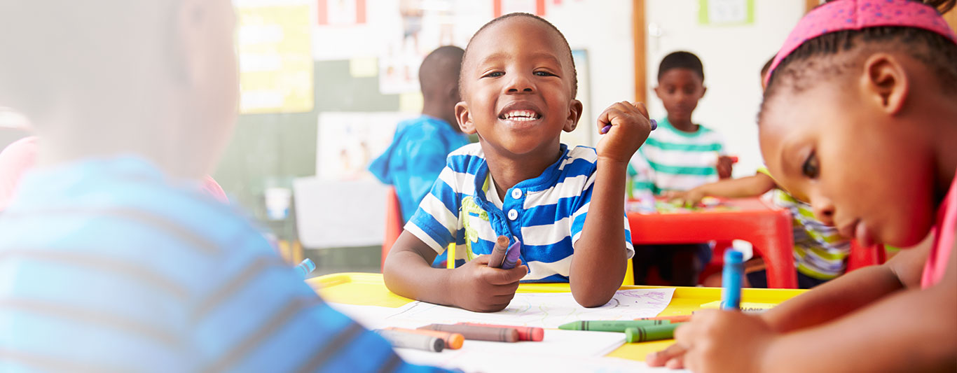 A child working at a classroom table