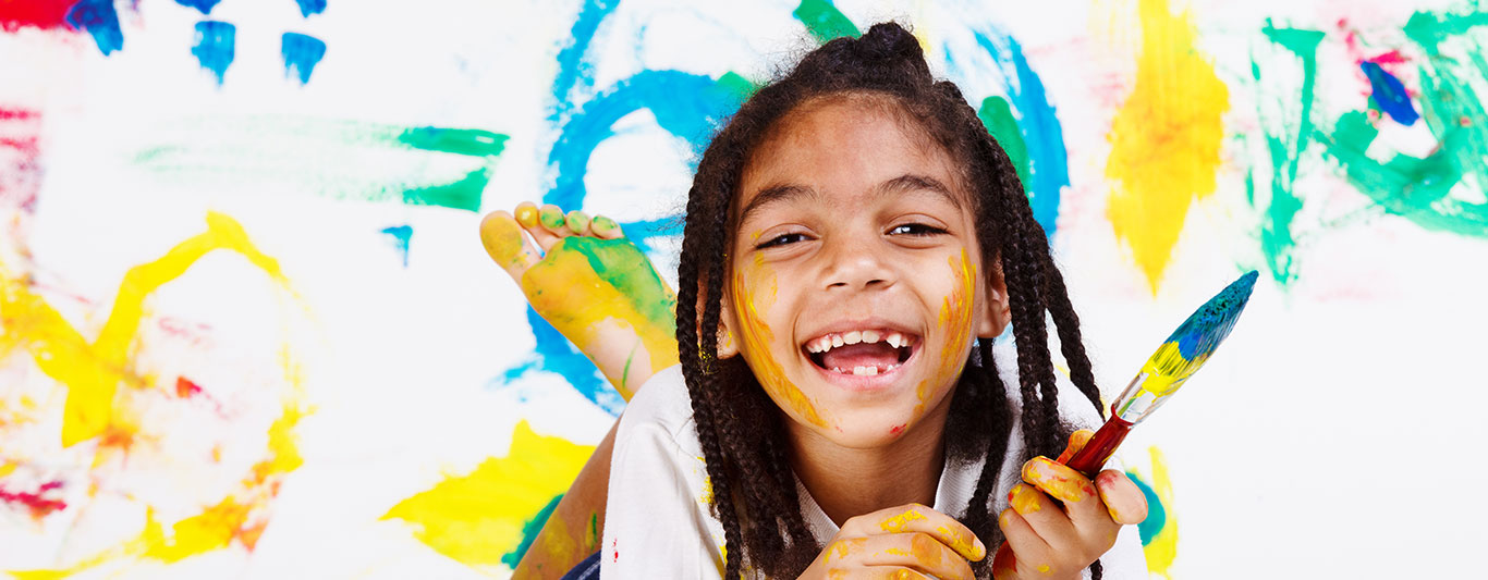 A child painting during Head Start